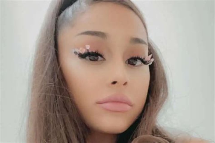 Ariana Grande Is Casual Chic In Jeans, A Cropped Sweater, And Combat Boots