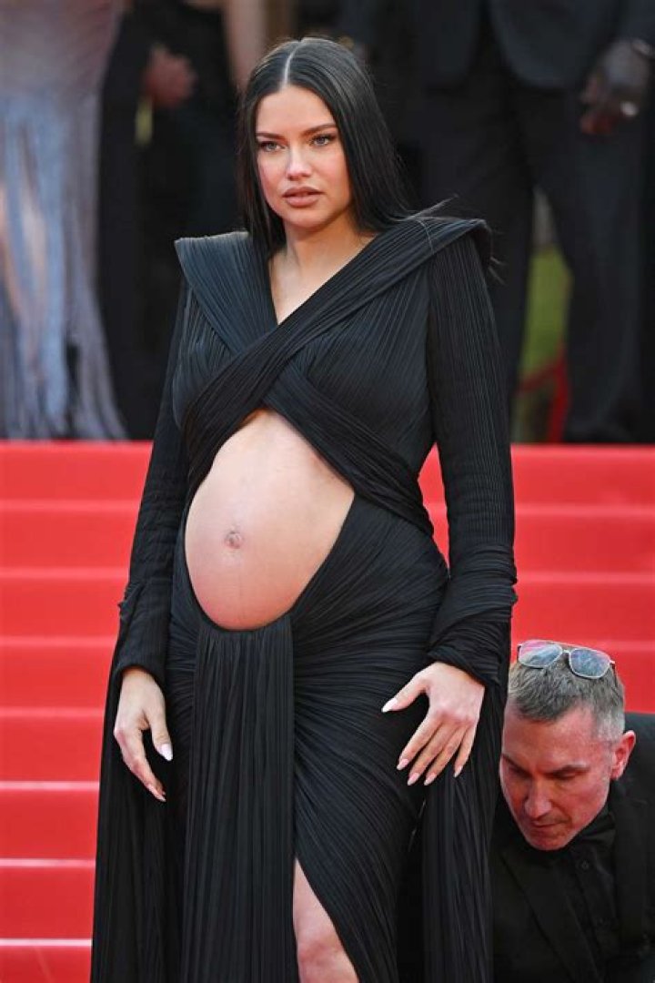 Pregnant Adriana Lima took to the red carpet of Cannes with a bare belly